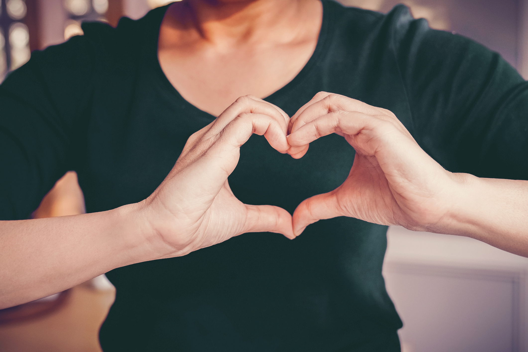 Mood picture woman showing a heart with hand
